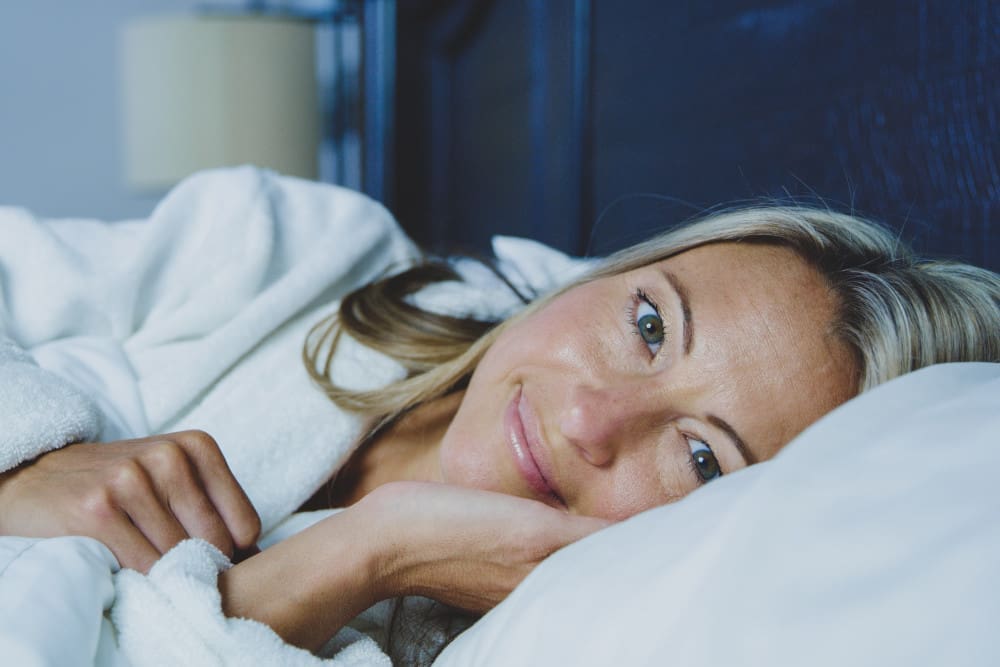 woman-in-robe-in-bed