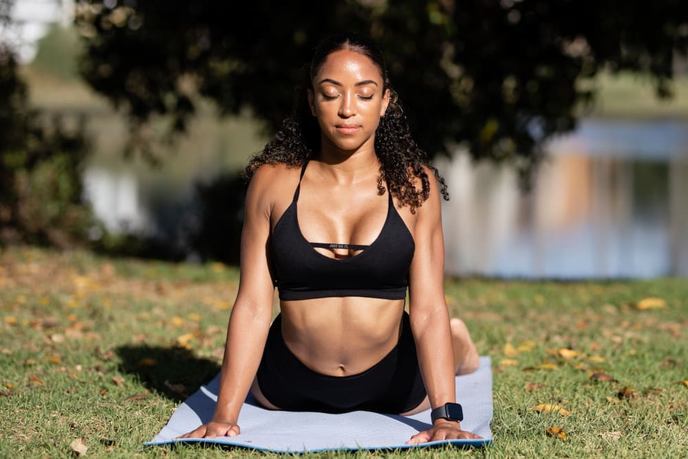 woman-doing-yoga-outside - Pacifica Center For Plastic Surgery woman doing yoga outside