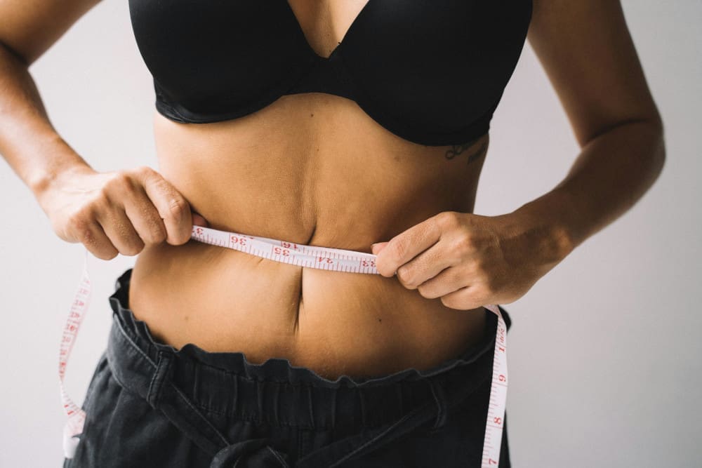 woman with tape measure